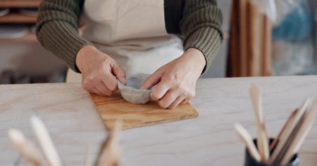 Clay bowl, woman hands and sculpture in artist studio, workshop and small business of creative product, craft and pottery. Ceramic designer, artisan and creation class, mold form and handmade processの写真素材