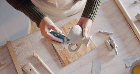 Pottery, art and senior asian woman mold clay in home studio or workshop. Potter, artist and retired...
