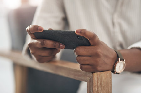 Scoring business deals left and right. a businesswoman using her smartphone to send text messages.