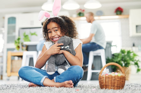 Me Egg-cited How can you tell. a young girl sitting on the floor with easter eggs at home.