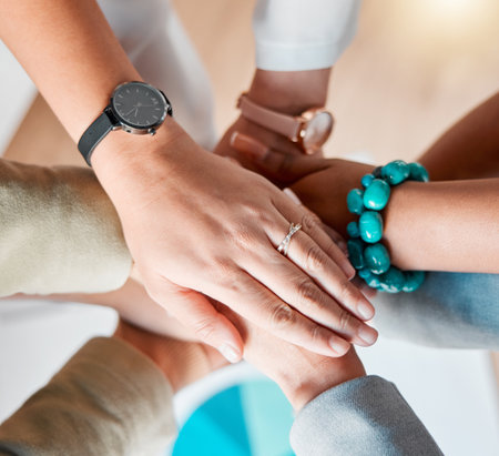Business people, hands together zoom and diversity of women in office feeling support and success. Happiness, collaboration and teamwork of workers with work cooperation, trust and motivationの写真素材