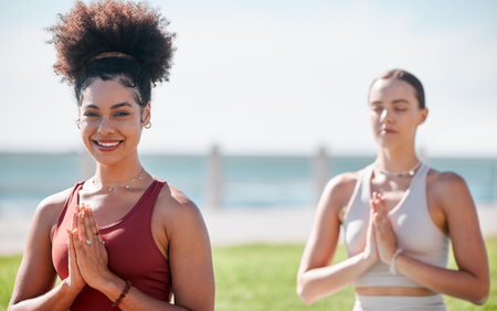 Yoga, praying and portrait of black woman in zen fitness class, exercise and mindfulness for healing and peace. Meditation, beach or park of sports people or USA personal trainer prayer and namasteの写真素材