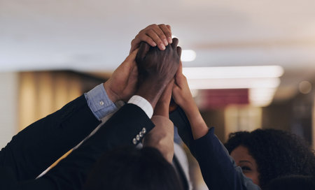 Unity is our greatest strength. Closeup shot of a group of unrecognisable businesspeople joining...