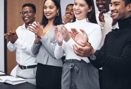 Im so proud of this team. a group of colleagues applauding a job well done.