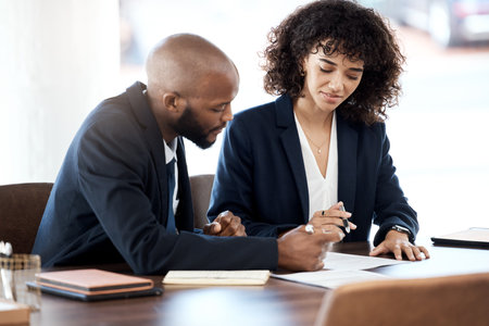 Contract consulting, business and black people planning of accounting budget, company portfolio or bank review. Teamwork, financial advisor and analysis of notes, investment report or legal paperworkの写真素材