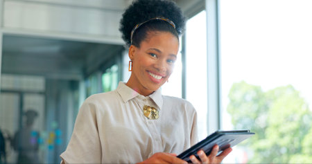 Tablet, smile and face of business woman in office for planning, email and social media news. Success, motivation and idea with employee browsing on report for research, internet and technologyの写真素材