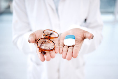 Eye care, choice with glasses or contact lens in hands, closeup and vision with healthcare for eyes....