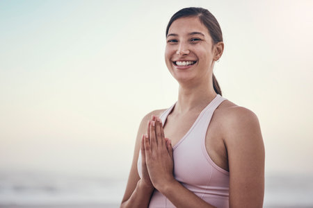 Portrait, woman and yoga at the beach for wellness, peace and zen, pose and balance on light mockup. Face, girl and meditation, training and energy outdoor for peaceful, mindset or chakra workoutの写真素材