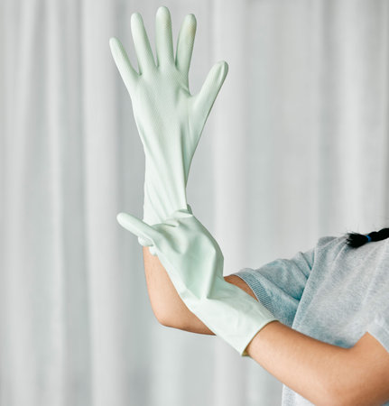 Cleaning gloves, hands and woman in a home ready to start bacteria and mess removal for safety....