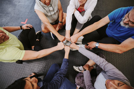 Fist bump, fitness and people n gym training group, circle and community support teamwork for...