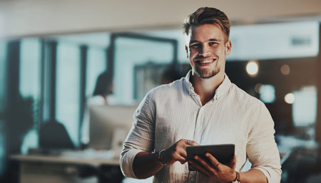 Gotta get connected to get the job done. Portrait of a young businessman using a digital tablet in...