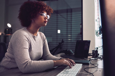Night, computer typing and black woman programmer, software developer and cybersecurity internship....