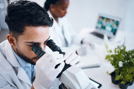 Science, research and male scientist with a microscope for an analysis, test or experiment in...