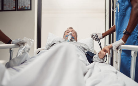 Hospital, senior patient and doctors for emergency on a bed with oxygen mask for healthcare. Sick...