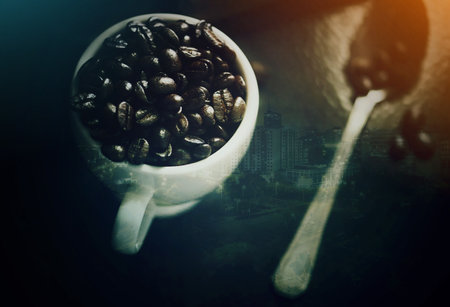 Coffee cup, double exposure and beans with city, skyline and mockup space for cafe, drink and aroma. Matcha, espresso and overlay with urban, metro and cbd for energy, holographic mock up and townの写真素材