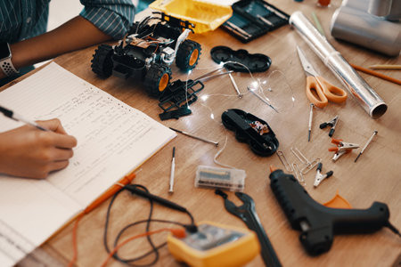 Hes already got a solution to the problem. an unrecognizable young boy doing his homework on...