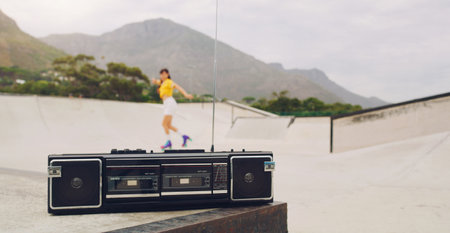 Music, park and woman rollerskating with a stereo for fitness, training and learning in Norway. Freedom, practice and girl skating for exercise with a radio for motivation, fun and skate cardioの写真素材