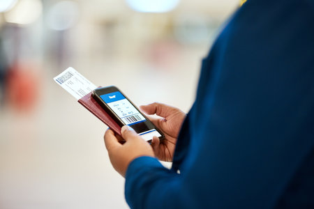 Qr code, check in and man with a phone for a ticket, airplane booking and information at airport. Travel, website and hand of a businessman reading a barcode on a mobile for a work trip or vacationの写真素材