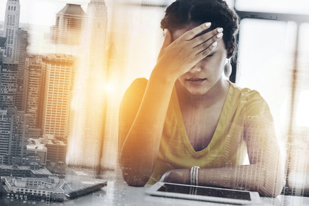 Will I ever see an end to these deadlines. a young designer looking stressed out while working in an office.の写真素材