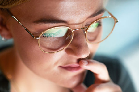 Woman, thinking and night in office with closeup for ideas, brainstorming and working late for...