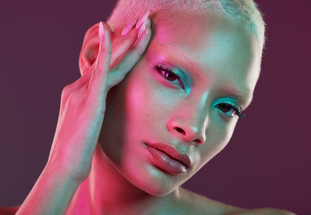 Skincare, beauty and cyberpunk, portrait of woman with neon makeup and lights for creative advertising on studio background. Art girl, cosmetics and model isolated for futuristic face mockupの写真素材