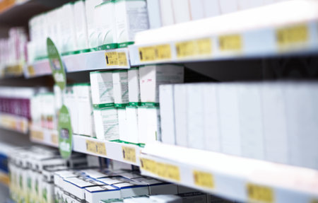 All you need to maintain your health. shelves stocked with various medicinal products in a pharmacy.の写真素材