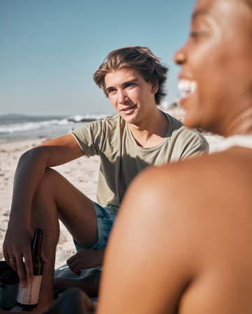Man, black woman or people bonding on beach sand and beer, alcohol drink or cider in holiday, vacation or summer travel. Smile, happy or picnic friends by ocean in community support or relax freedomの写真素材