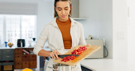 Woman, cooking and kitchen, vegetable and nutrition, board and knife, healthy food and diet at home....