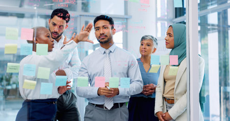 Meeting, collaboration and sticky notes with a business man training a team while planning strategy...