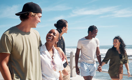 Couple of friends, walking and bonding by beach, ocean or sea in group social gathering, community...