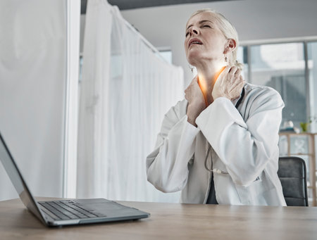 Injury, burnout and a doctor with neck pain, inflammation and stress from healthcare work. Anxiety, problem and tired mature medical professional with a painful body, stressed and tense from careerの写真素材