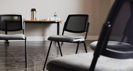 Group therapy, mental health or circle furniture in empty room, clinic or asylum building for...