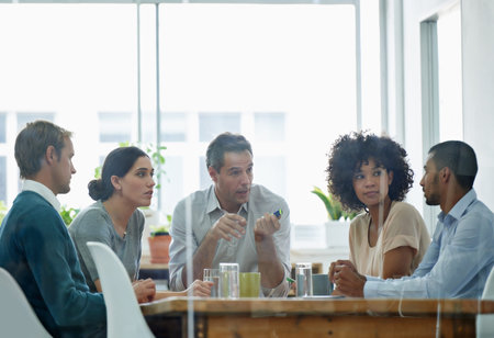 There is no I in teamwork. Cropped shot of a group of colleagues in a business meeting.