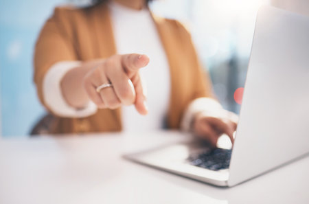 Hand, pointing and laptop in office with black woman, hr expert and question at desk for recruitment. Human resources, manager and choice for hiring, opportunity or job for future employee at companyの写真素材