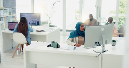 Computer, documents or Muslim startup woman research review, data analysis or company KPI growth report. Technology, creative or female employee typing calendar agenda, marketing or social media SEOの写真素材