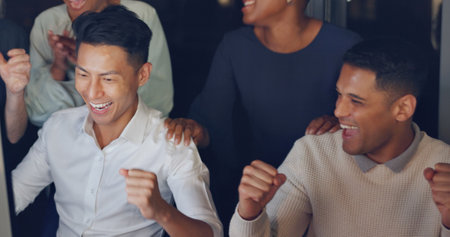 Clapping, winning and business people on computer at night for global sales, stock market or results. High five, celebration and wow for winner or worker group of online target, data review and goalsの写真素材