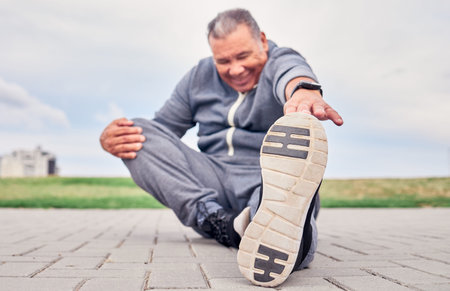 Man, stretching foot and fitness on park ground for training, performance and wellness. Senior male...