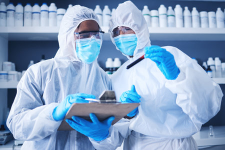 Teamwork, blood checklist or doctors in lab with notebook for research, medical exam or sample analysis. Healthcare, biotechnology or scientist for medicine checklist, covid results or vaccine reportの写真素材