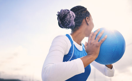 Mockup, netball and black woman training, fitness and exercise for wellness, healthy lifestyle and performance. Sky, African American female player and lady with ball, game and match with competitionの写真素材