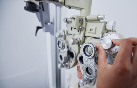 Eye exam, vision and hands of optometrist with patient in clinic for test, eyesight and optical...