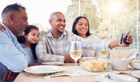 Black family selfie, lunch and happy in home with men, women and girl at table for celebration on web app. Man, digital photography app or profile picture for social media with kid, parents and womanの写真素材