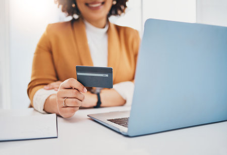 Credit card, business woman and laptop for ecommerce, online shopping or payment with fintech. Entrepreneur person hands for finance, banking and digital wallet or transaction on mockup websiteの写真素材