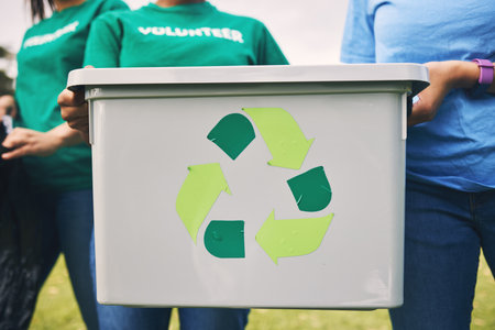 Recycle bin, earth day volunteer and community park cleaning outdoor for eco friendly and sustainability. Working, recycling and trash collection of young people doing green ecology and charity workの写真素材