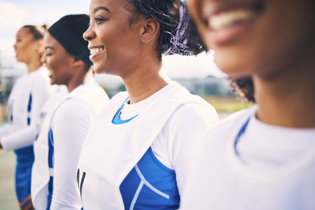 Sports, netball and team of women with smile ready for training, exercise and fitness workout on court. Diversity, teamwork and row of happy girl athletes with motivation for game, match and practiceの写真素材