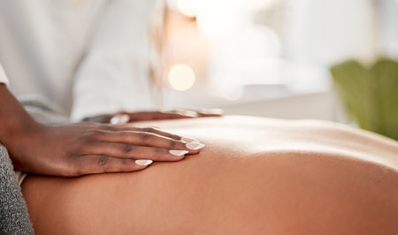 Hand, back massage with masseuse and skin, women at holistic center or spa with wellness, physical therapy and zen. Health, peace of mind and stress relief, self care and lifestyle with healingの写真素材