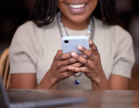 Black hands, closeup and cellphone for social media, search internet and connection for typing. Zoom, African American female and girl with happiness, smartphone and website for information and newsの写真素材