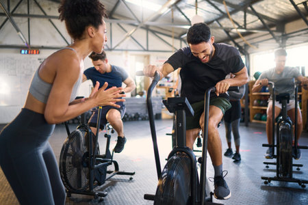 Cycle spinning, fitness and applause of a coach with motivation for cycling gym training. Sports...