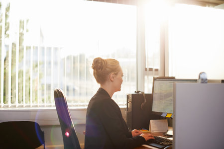 Shes straight to business. an attractive businesswoman using her work computer.の写真素材
