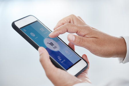Smartphone, ecommerce and mobile app payment, fintech and digital store, money and banking, data or finance technology. Man press cellphone dashboard, online shopping cart icons and financial networkの写真素材