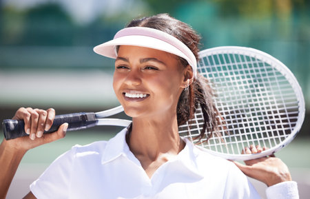 Sports, tennis and black woman outdoor, happiness and success with training, workout and wellness. Female player, lady and athlete on court, racket and practice for match, competition and healthyの写真素材